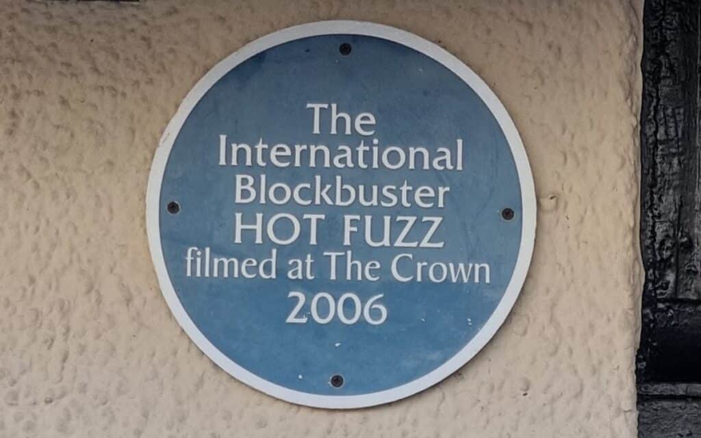 A sign at The Crown At Wells noting it was the filming location of Hot Fuzz in 2006.